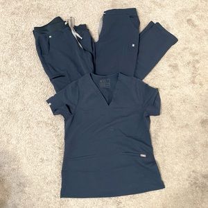 Figs 2 pairs of scrub bottoms and one scrub top.